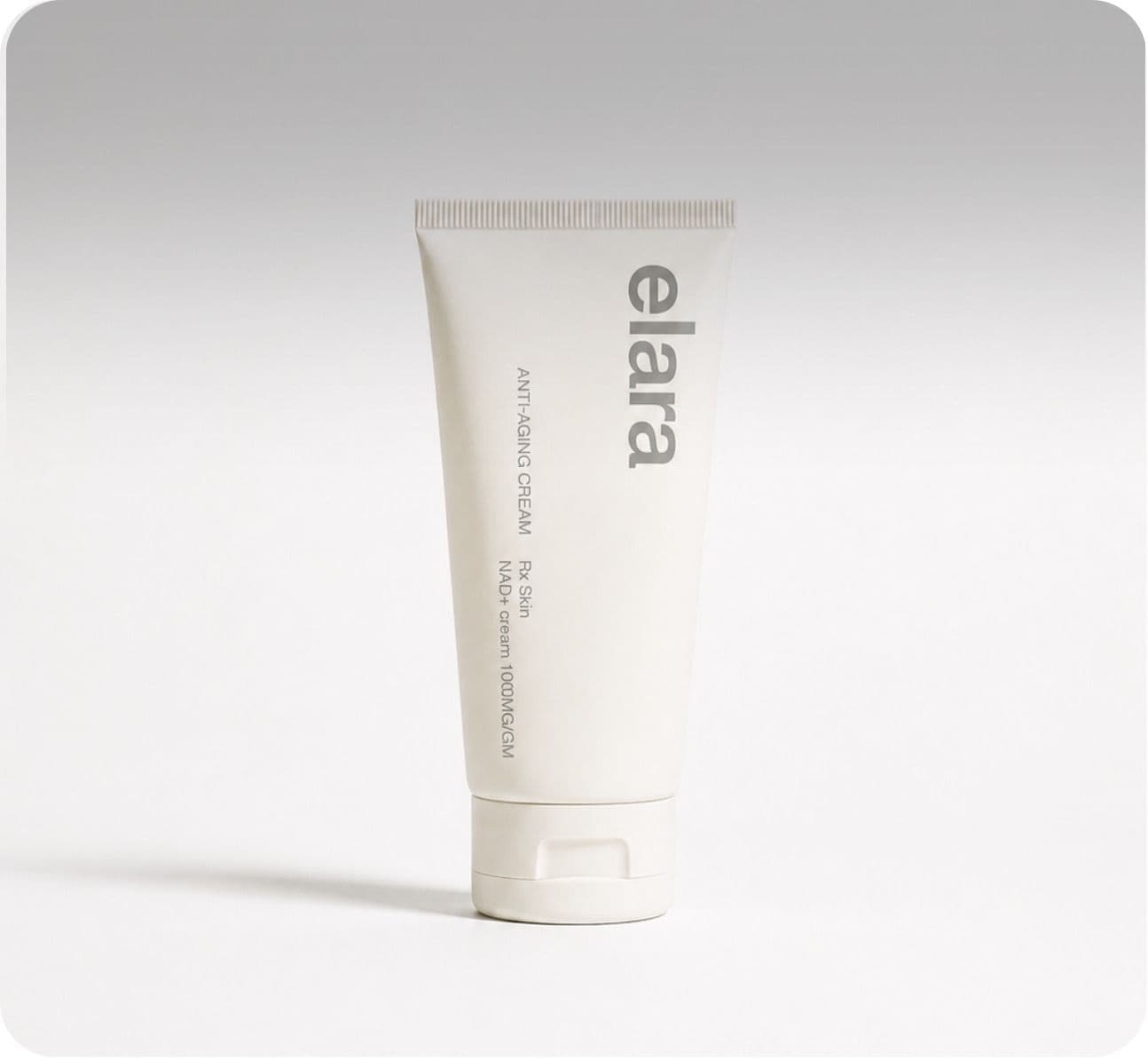 An Elara NAD+ anti-aging cream tube standing on a grey sweep