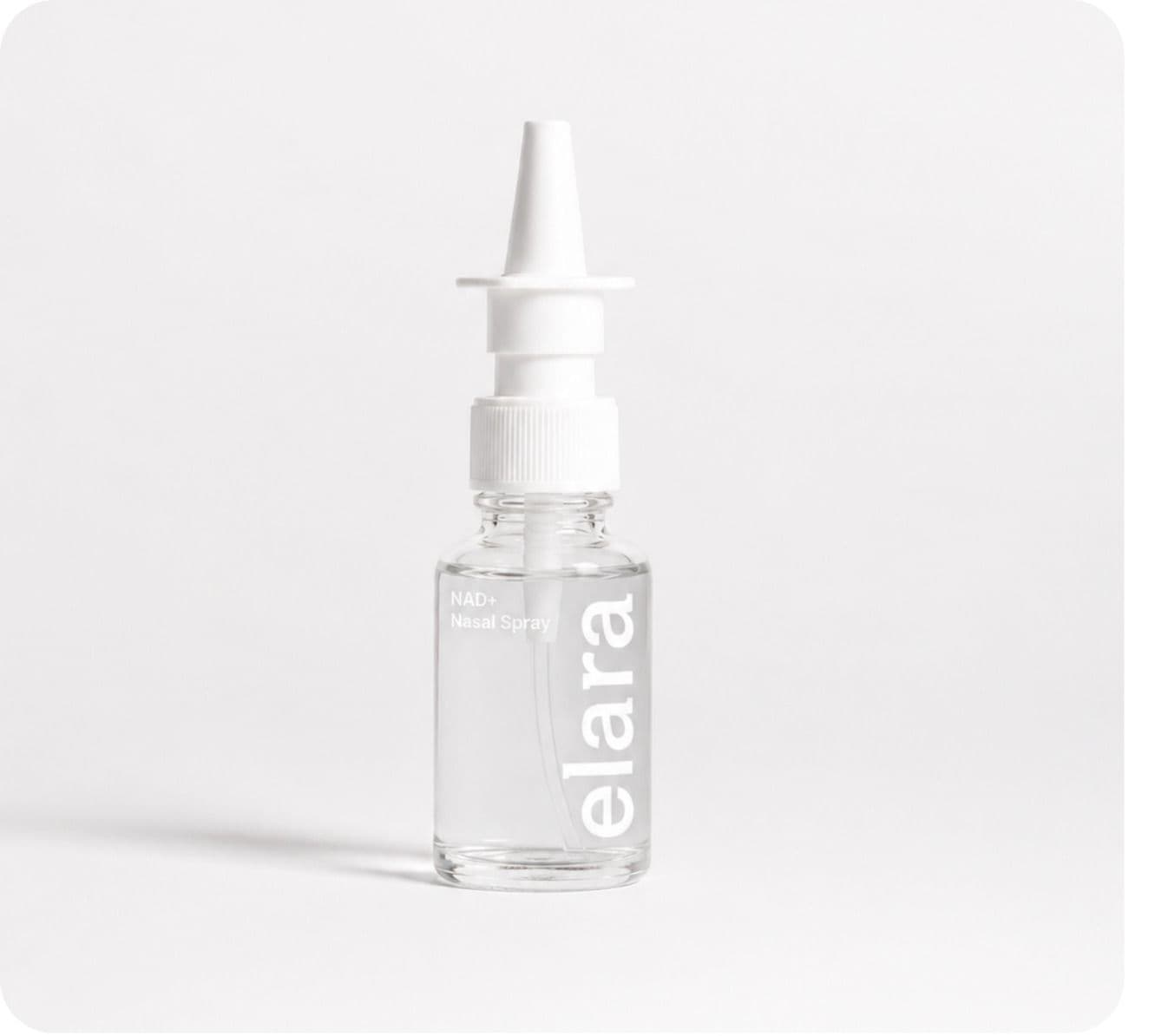 An Elara NAD+ nasal spray bottle standing on a pale sweep