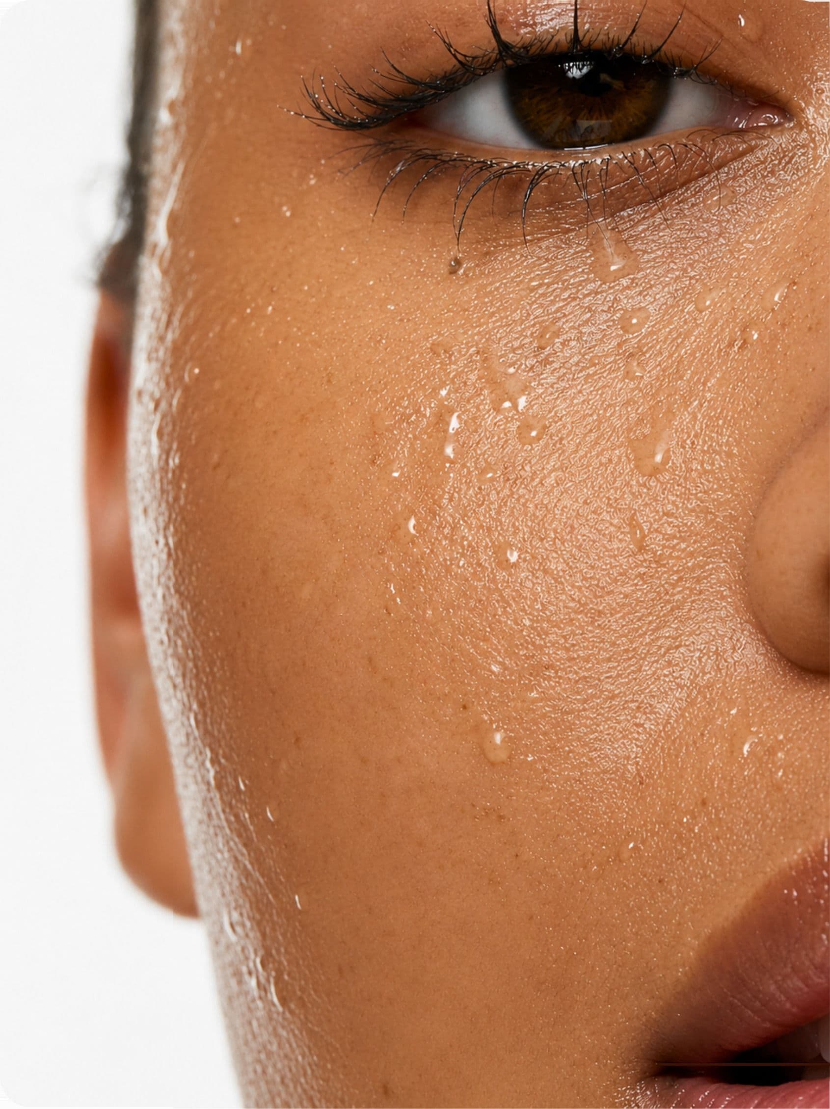 Water beading on a woman's cheek
