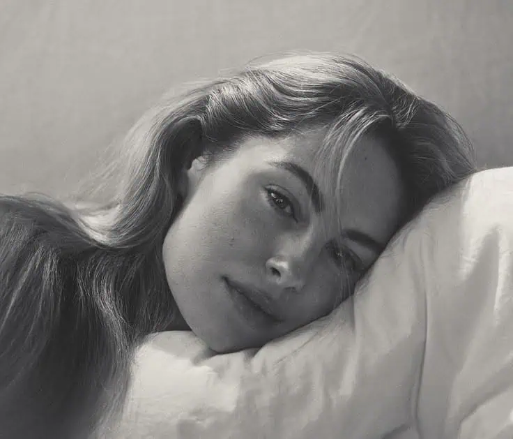 Woman lying on a pillow with long hair