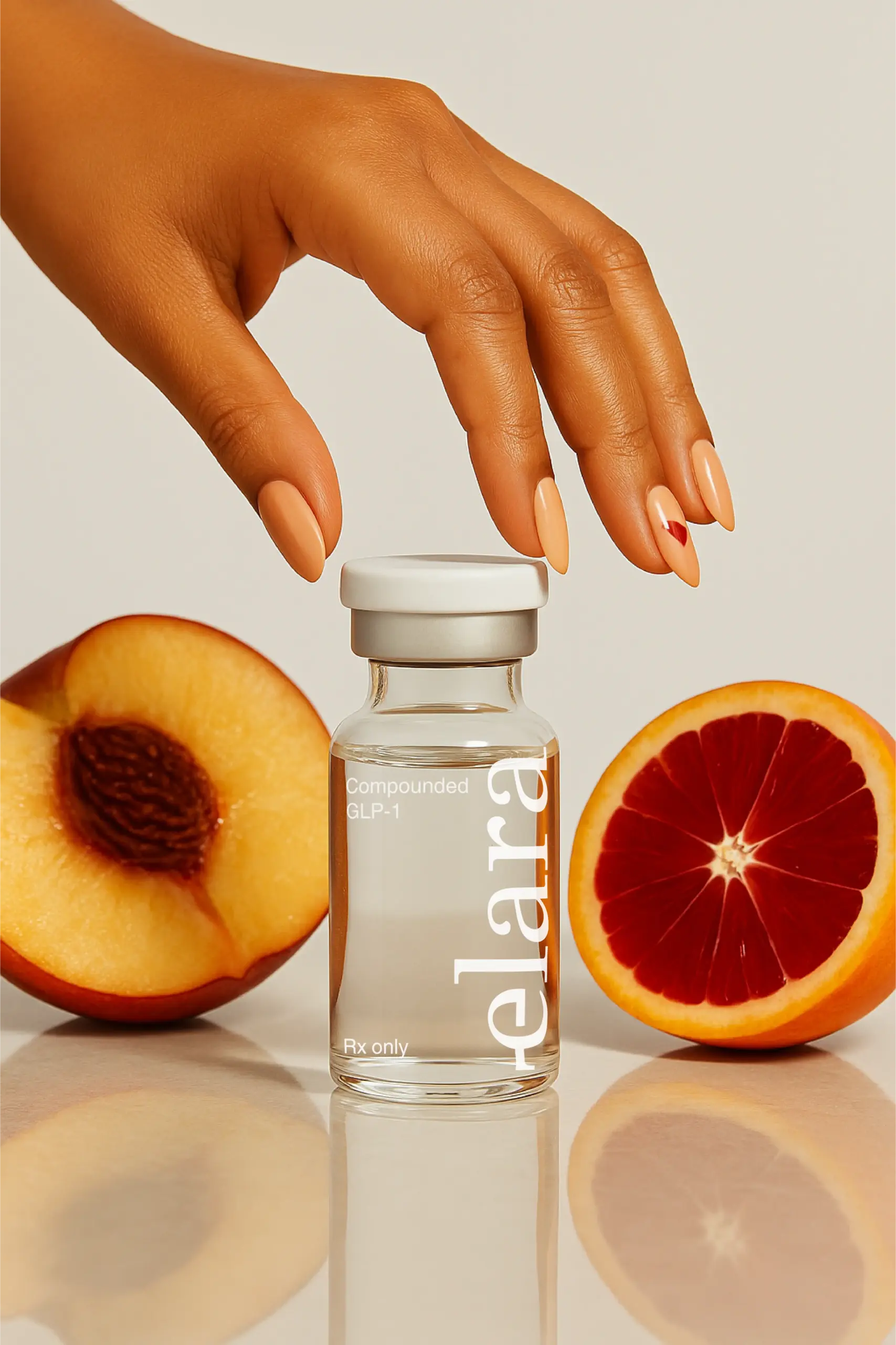 Elara vial with peach and blood orange representing natural ingredients